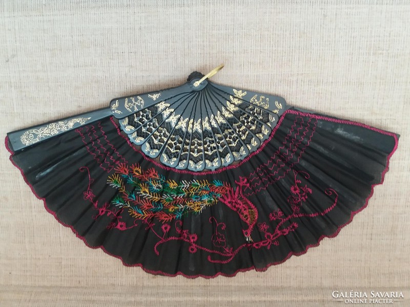 Retro silk material with hand-embroidered fan on it