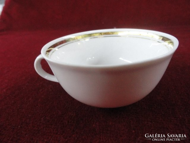 German porcelain coffee cup with a gold stripe on a snow-white background. He has!