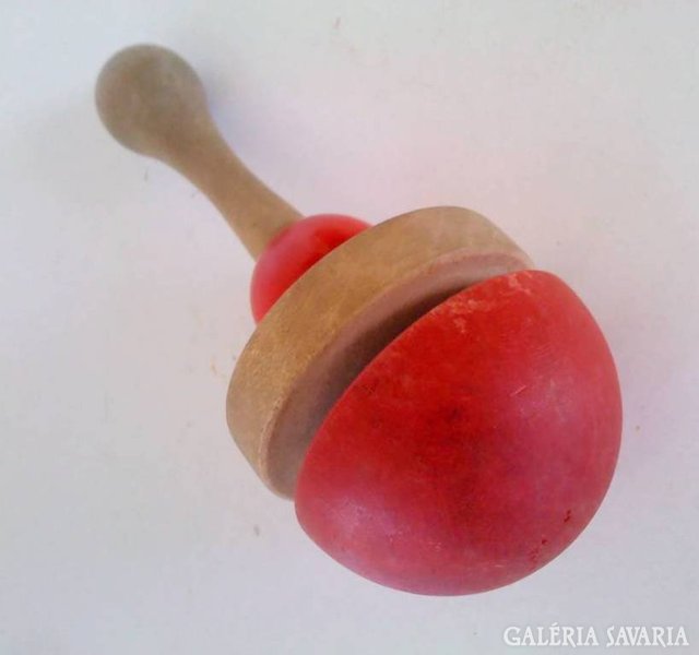 Old wooden children's rattle and hitchhiking tree