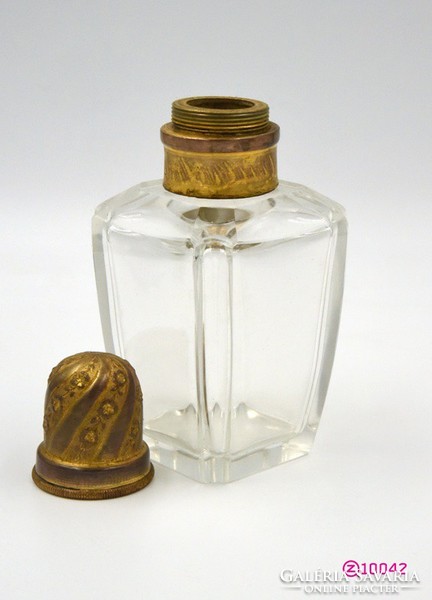Polished glass perfume holder with copper application and screw cap.