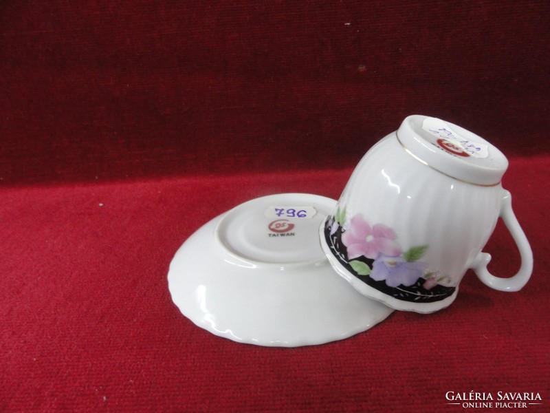 Os Taiwanese porcelain coffee cup + saucer with wavy edges and blue/pink flowers. He has!