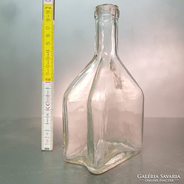 Colorless, medium-sized, concave-sided liquor bottle (854)
