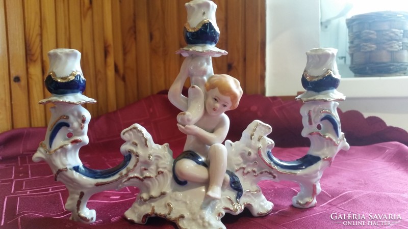 Antique crown regal fine porcelain three-prong candle holder with putto.