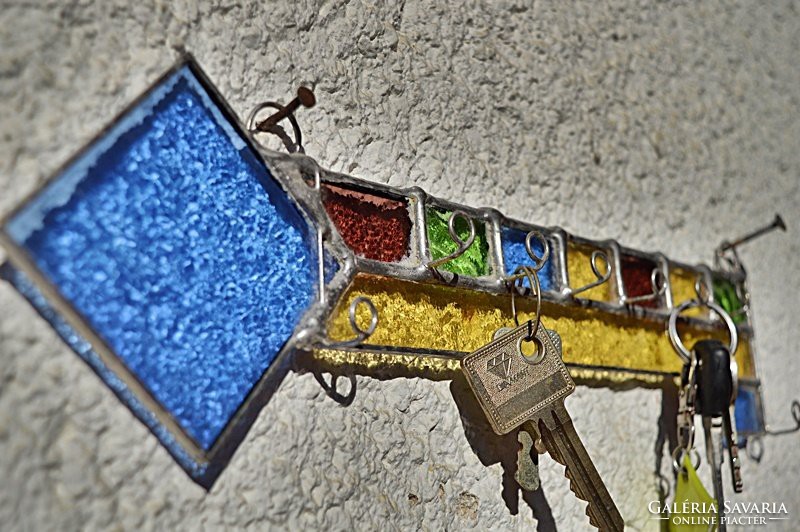 X. Tiffany 8-piece wall key holder by artist.