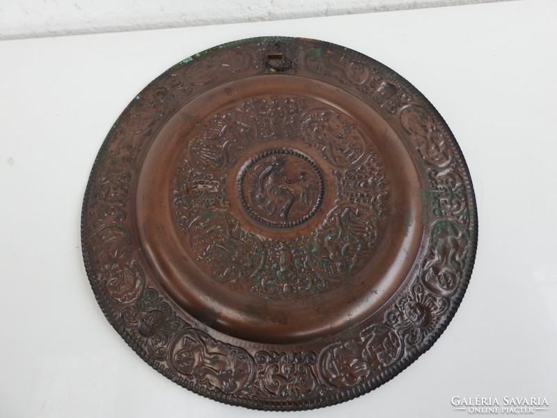Red copper plate wall plate with a relief pattern with a mythological scene - decorative plate