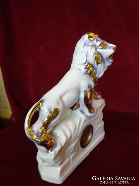 Lion fireplace clock, clock cleaned set. Height 31 cm and width 26 cm. He has!
