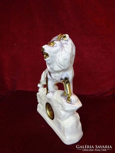 Lion fireplace clock, clock cleaned set. Height 31 cm and width 26 cm. He has!