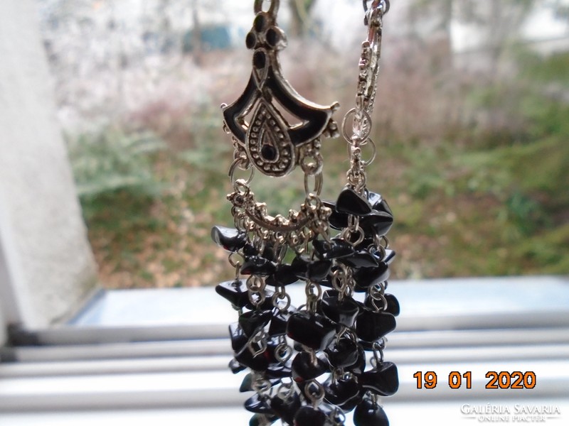 Black mineral with small stones on chain links chandelier earrings on ornate enamel frame