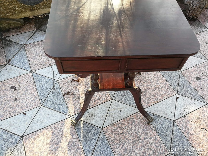 Old table with 2 drawers, a graceful piece of copper with lion's claw castors