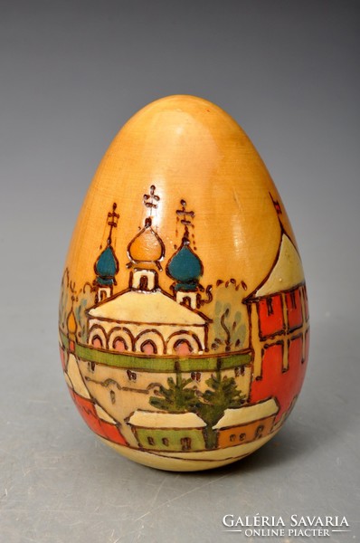 Antique hand painted Russian lacquered wooden egg with the image of orthodox churches.