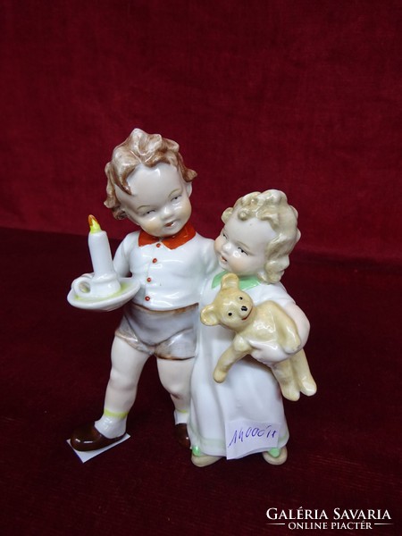 German porcelain figural sculpture, children's couple with teddy bear and candle. He has!