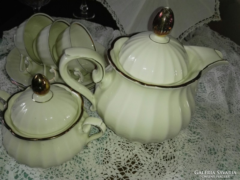 3 Personal tea set...On a bone-colored base with rose gold decoration.