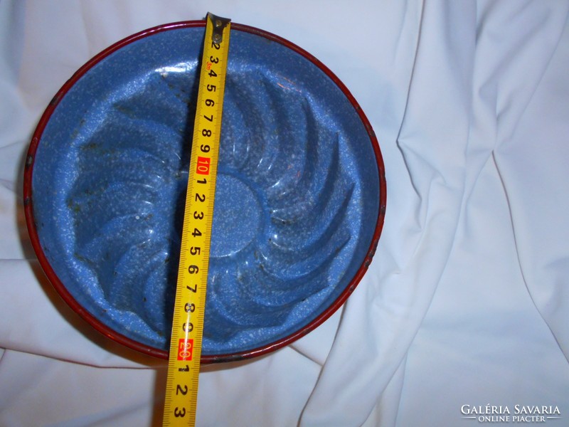Old confectionery tool in enamel dumpling form