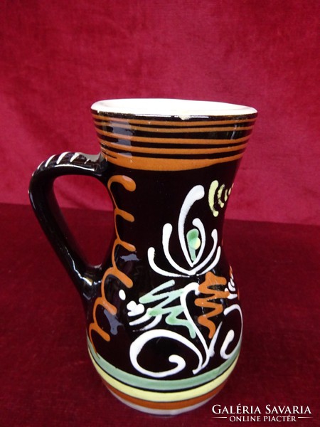 Hand painted ceramic jug with mud box. Height 16 cm. He has!