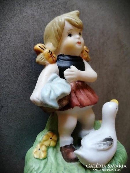 Little girl with goose, charming biscuit figure
