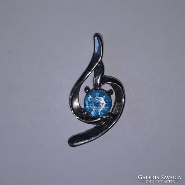 Silver colored pendant with blue swarovski stone