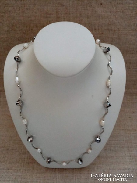 Brand name long steel necklace studded with cultured pearls