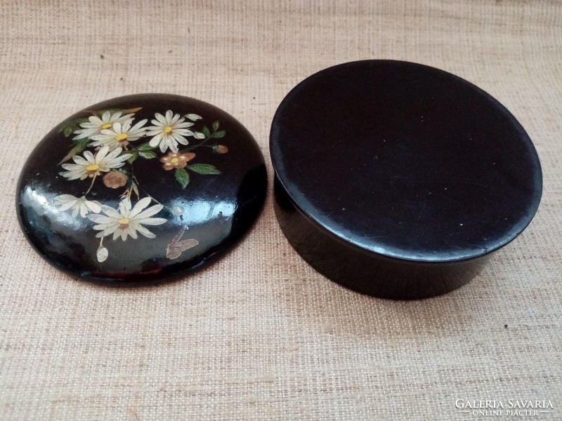 An old hand-painted lacquer box in beautiful condition with a small tablecloth with an antique beaten lace edge.