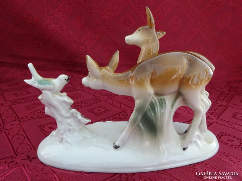 German porcelain figurine, deer with the little bird. Length 18.5 cm. He has!
