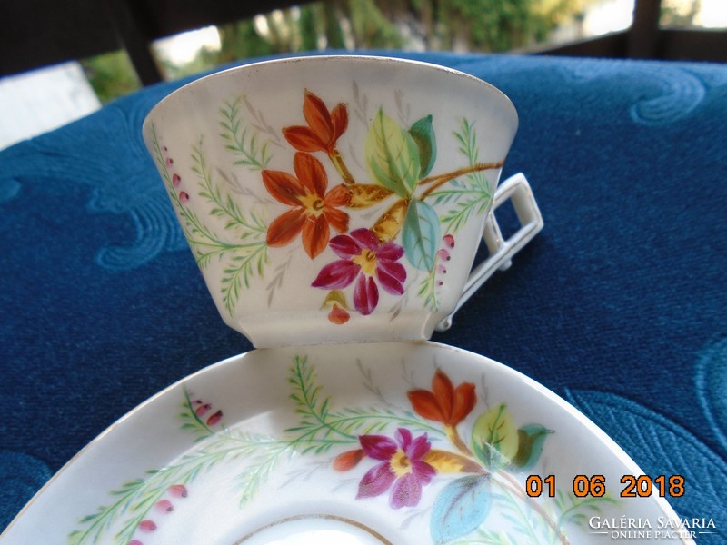 Hand-painted coffee cup with unique flower pattern over antique Art Nouveau glaze