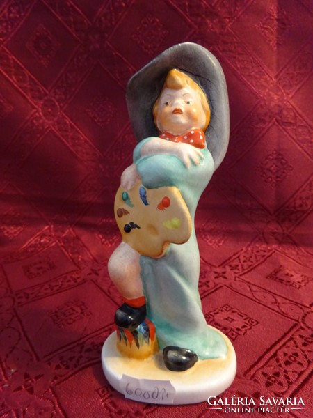 Ceramic craftsman Porcelain figural sculpture. Boy with painting palette. He has!