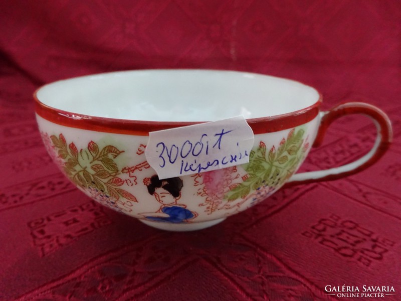 Hand-painted Japanese porcelain teacup with protruding geisha head at the bottom of the cup. He has!