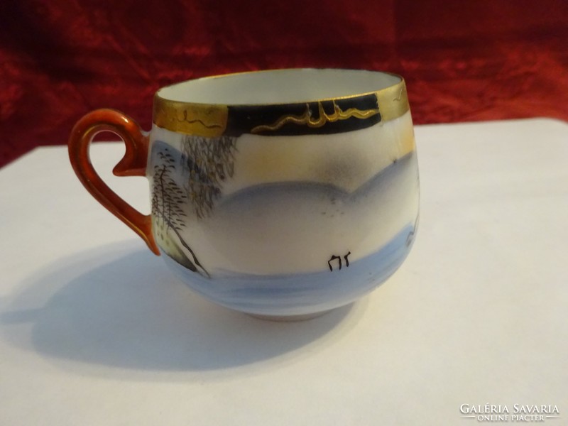 Japanese porcelain coffee cup, height 5 cm. He has!
