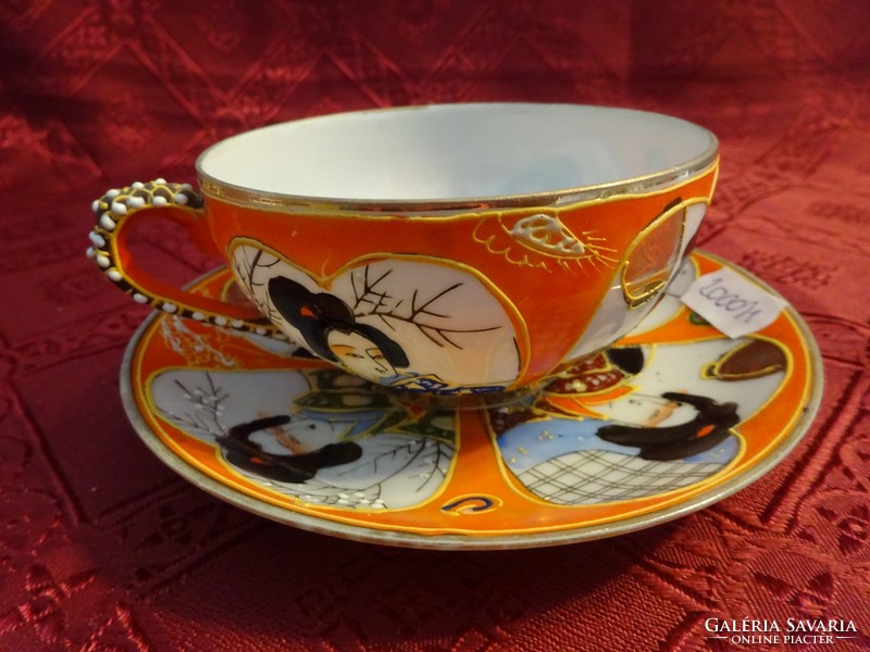 Japanese porcelain teacup + placemat. Geisha has a head at the bottom of the cup. He has!
