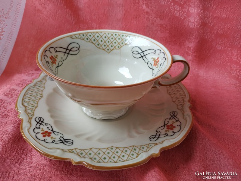 Antique porcelain coffee cup with saucer