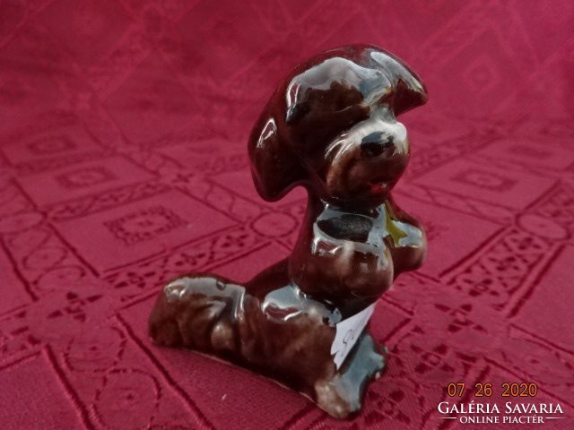 Glazed ceramic dog, brown, height 6.5 cm. He has!