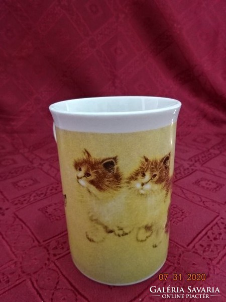 Porcelain mug, three cats with four butterflies. He has!