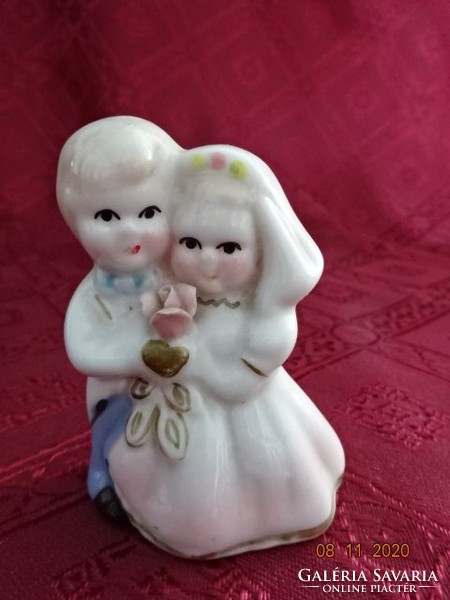 Porcelain figure, couple in love, height 7 cm. He has!