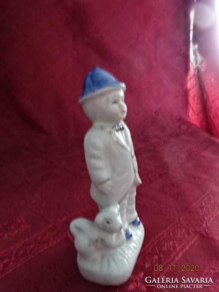 Porcelain figure, boy with dog, height 12.5 cm. He has!