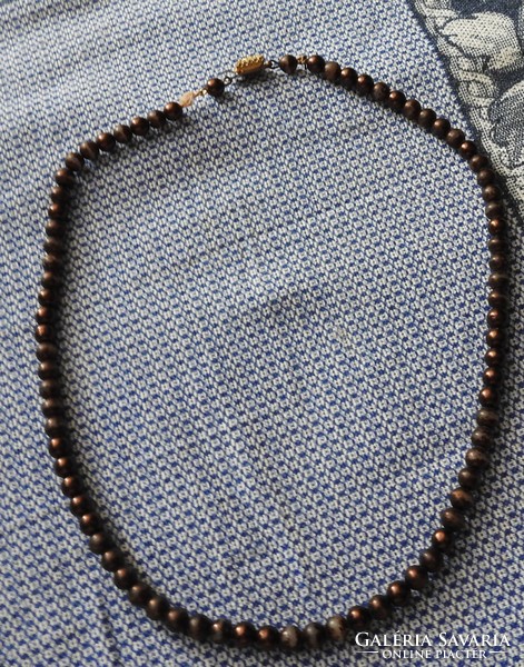 Old brown string necklaces