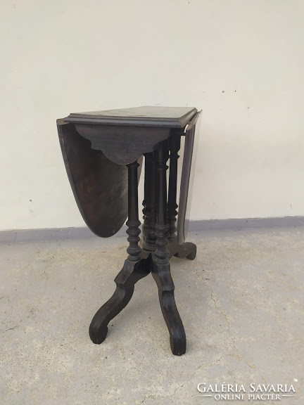 Antique neo-baroque black console table with unfoldable legs and fold-down table top