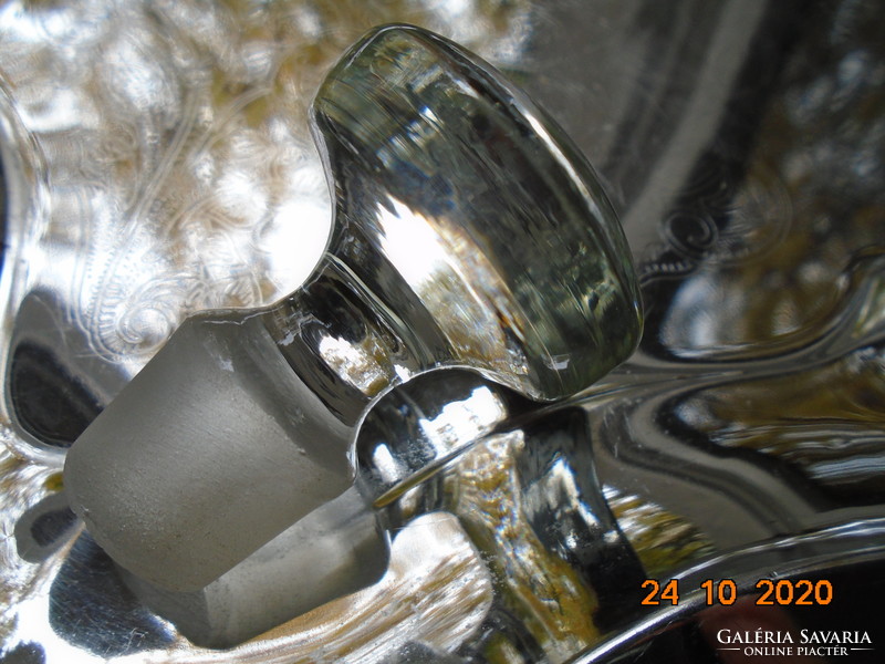 Older drink bottle with polished solid glass stopper, polished patterns.