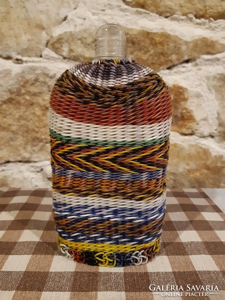 Flat bottle decorated with wire braid,