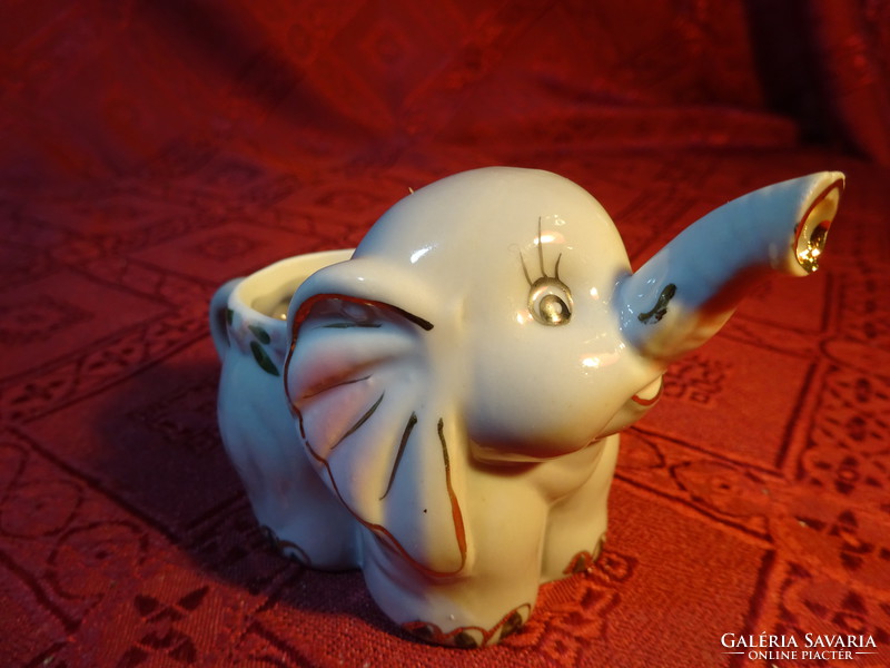 German porcelain elephant, gray base, pink handle, pouring function. He has!