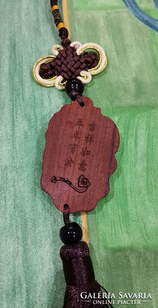 Real room. Feng shui rosewood pendant, amulet, abundance, happiness