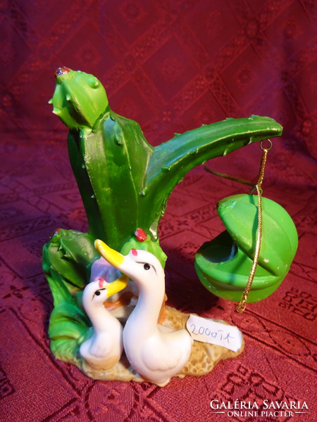 Porcelain candle holder and also a mini vase. Candle hanging on a cactus branch with two ducks. He has!