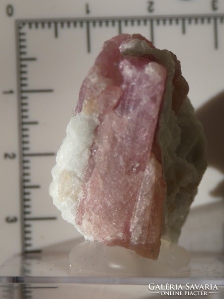 Natural rubellite (tourmaline version) crystals in the bedrock. Collector piece attached to a holder