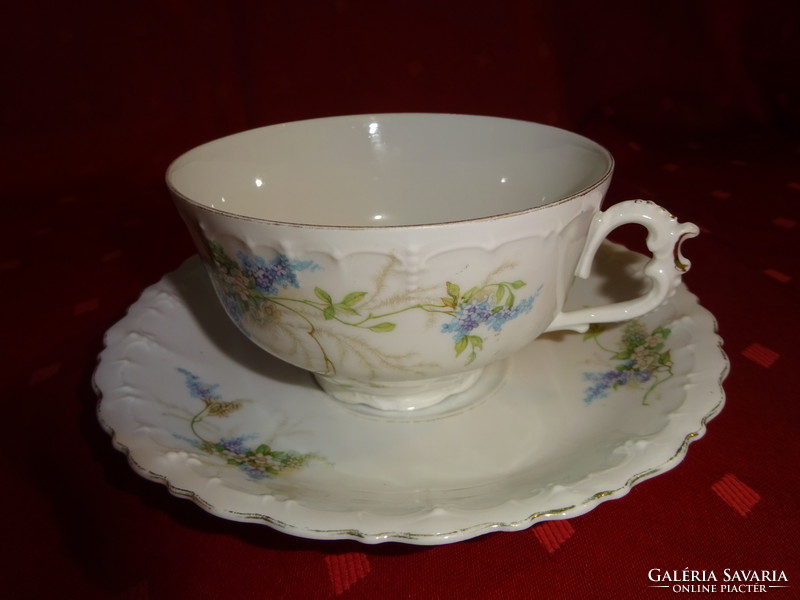 German porcelain, antique teacup + placemat. Piece kept in a display case. He has!