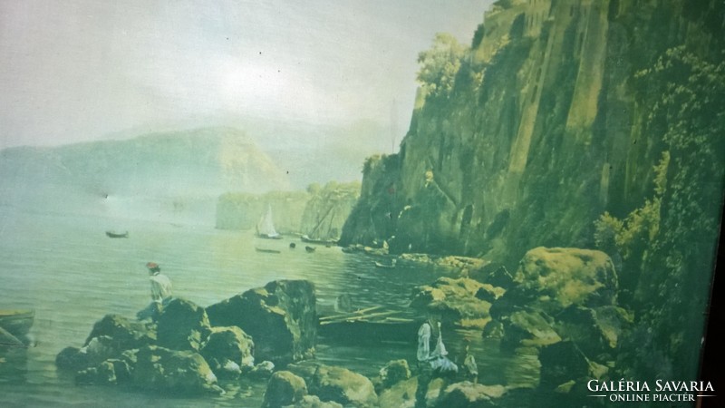 Rocky coastal bay with old large oil print on scratch