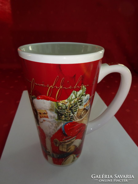 German porcelain Christmas mug with Santa's pattern, height 15.5 cm. He has!
