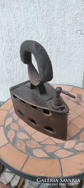 Antique copper, bronze iron. It is at least 100 years old. It weighs almost 3 kg!