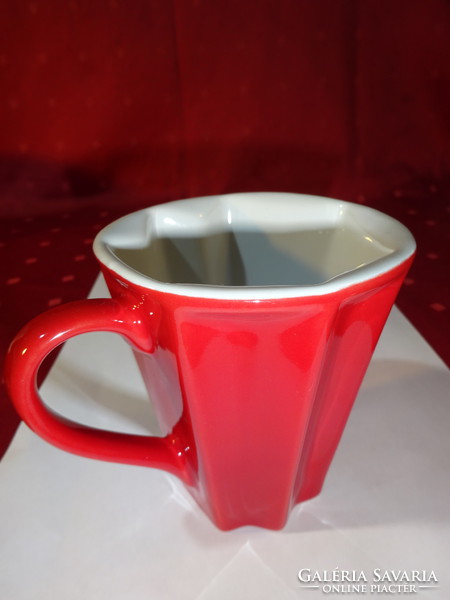 Hexagonal porcelain red mug, white inside, height 10 cm. He has!