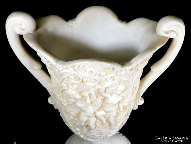 Large, bone-colored, heavy alabaster vase with putto and tendril pattern
