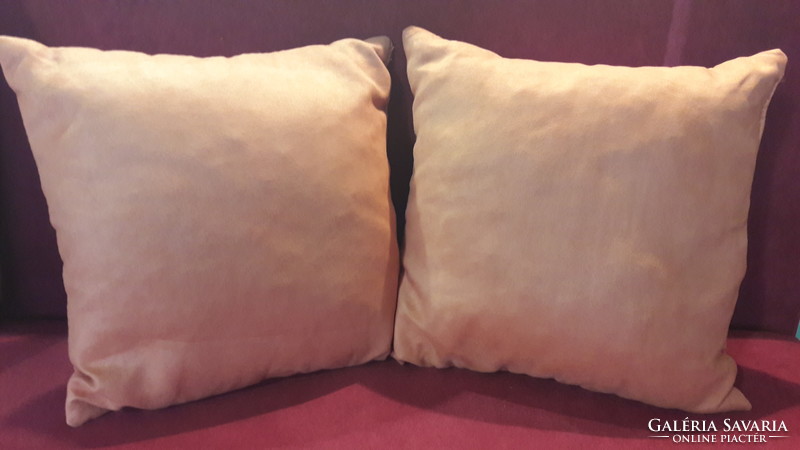 2 orange decorative pillows