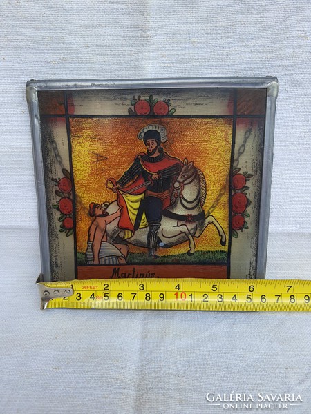 Martinus glass painted icon in tin frame.