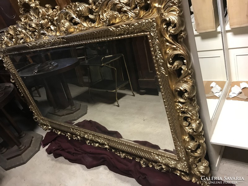 Polished mirror with golden frame